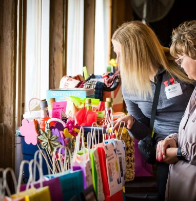 Pursuing our team's silent auction contributions at our summer picnic