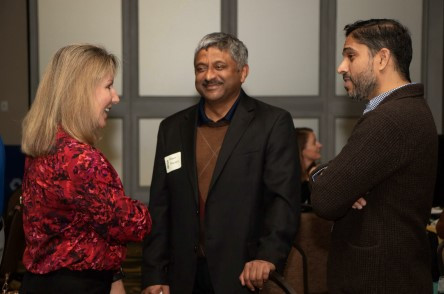 Team members catching up at our holiday party