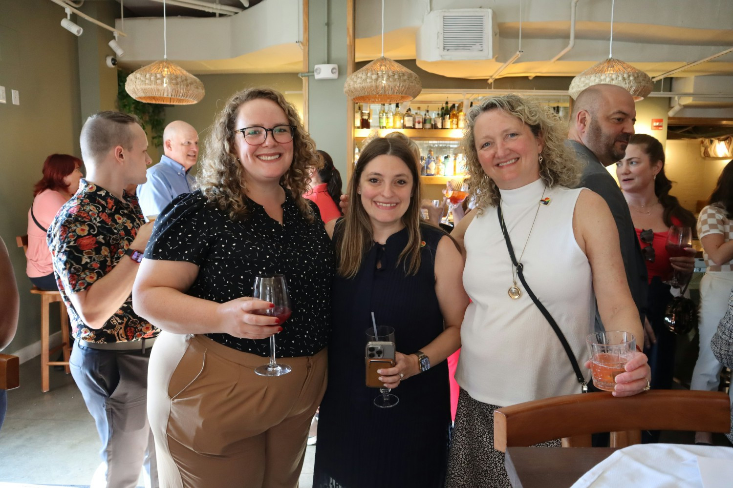 CSBS Staff enjoying an in-person happy hour event celebrating Pride Month hosted by the CSBS PRIDE ERG.
