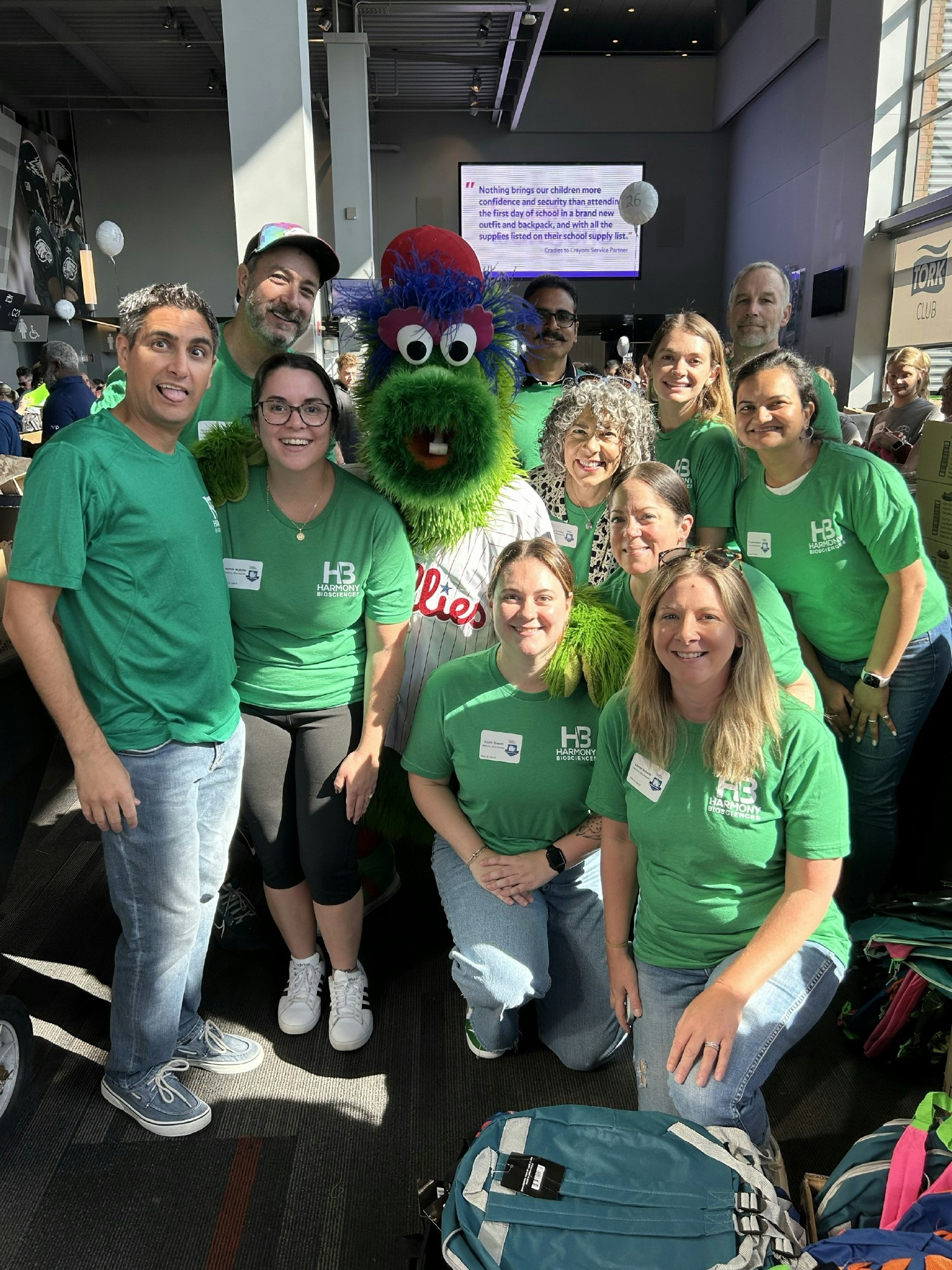 Volunteering at Cradles-to-Crayons backpack packing event.