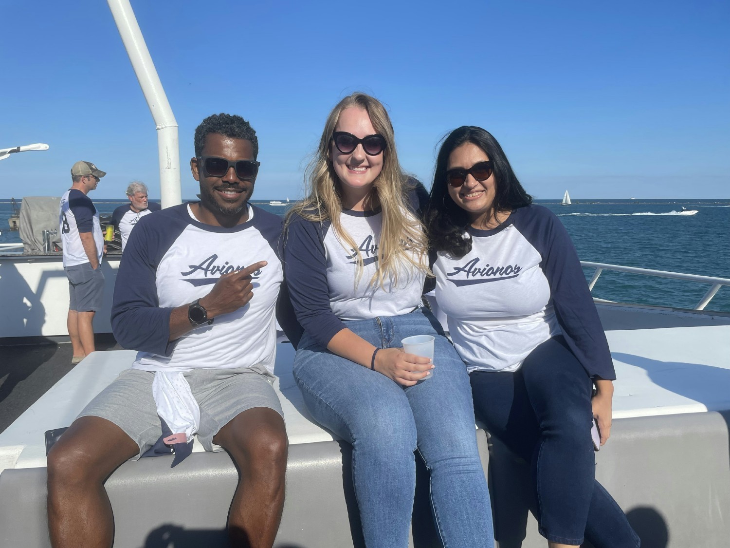 Members of Avionos' client services, delivery, and talent acquisition team enjoying an afternoon on Lake Michigan.