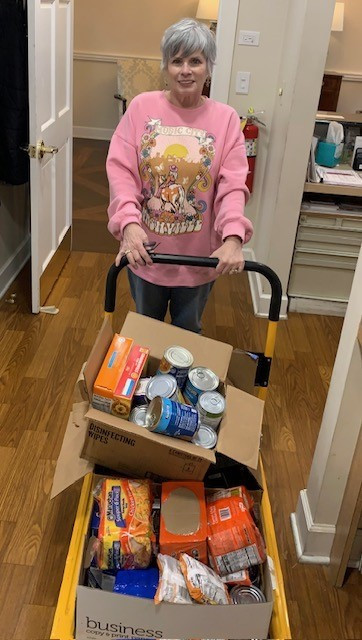 Mary Jo Rhodes, LED at WW Newnan gathering donations for the food drive sponsored by Bridging the Gap in Coweta County. 