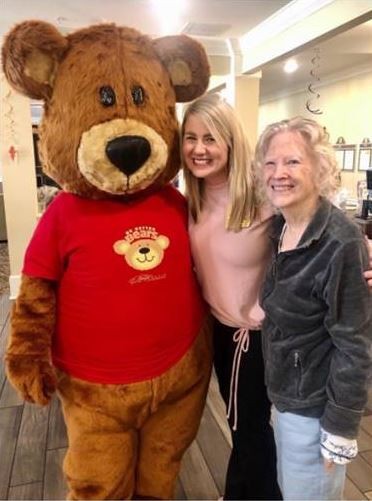 Our mascot, Benton the Bear, visiting Residents and Team Members at Benton House of Aiken!