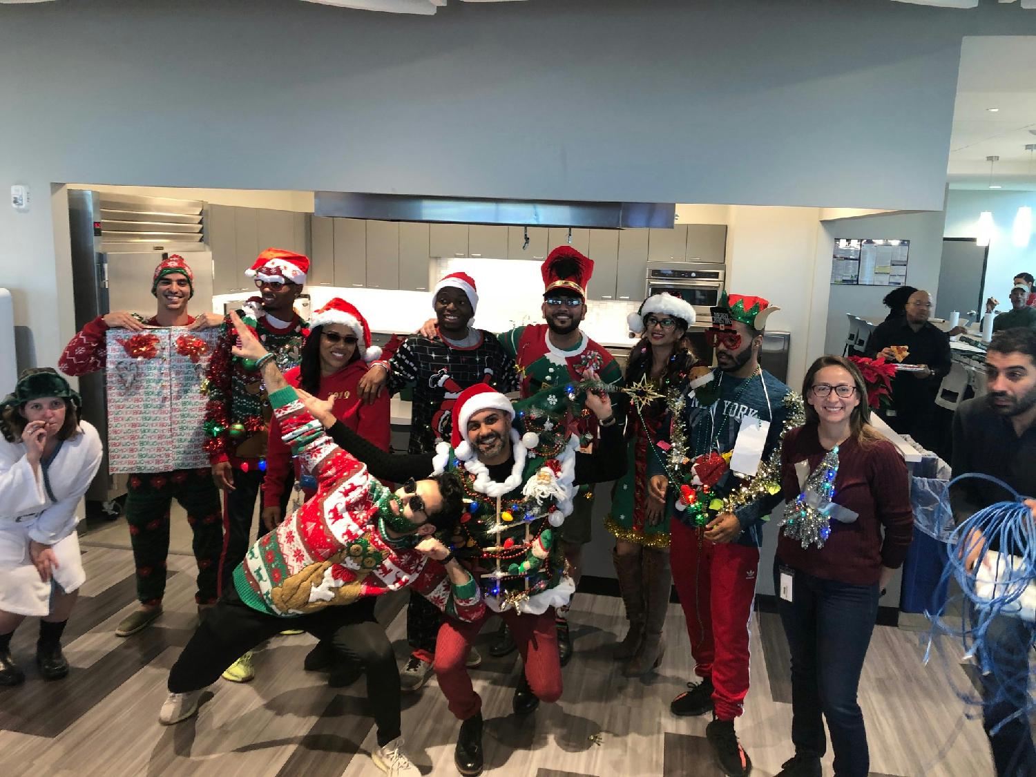 DHI employees taking part in the annual Ugly Christmas Sweater competition