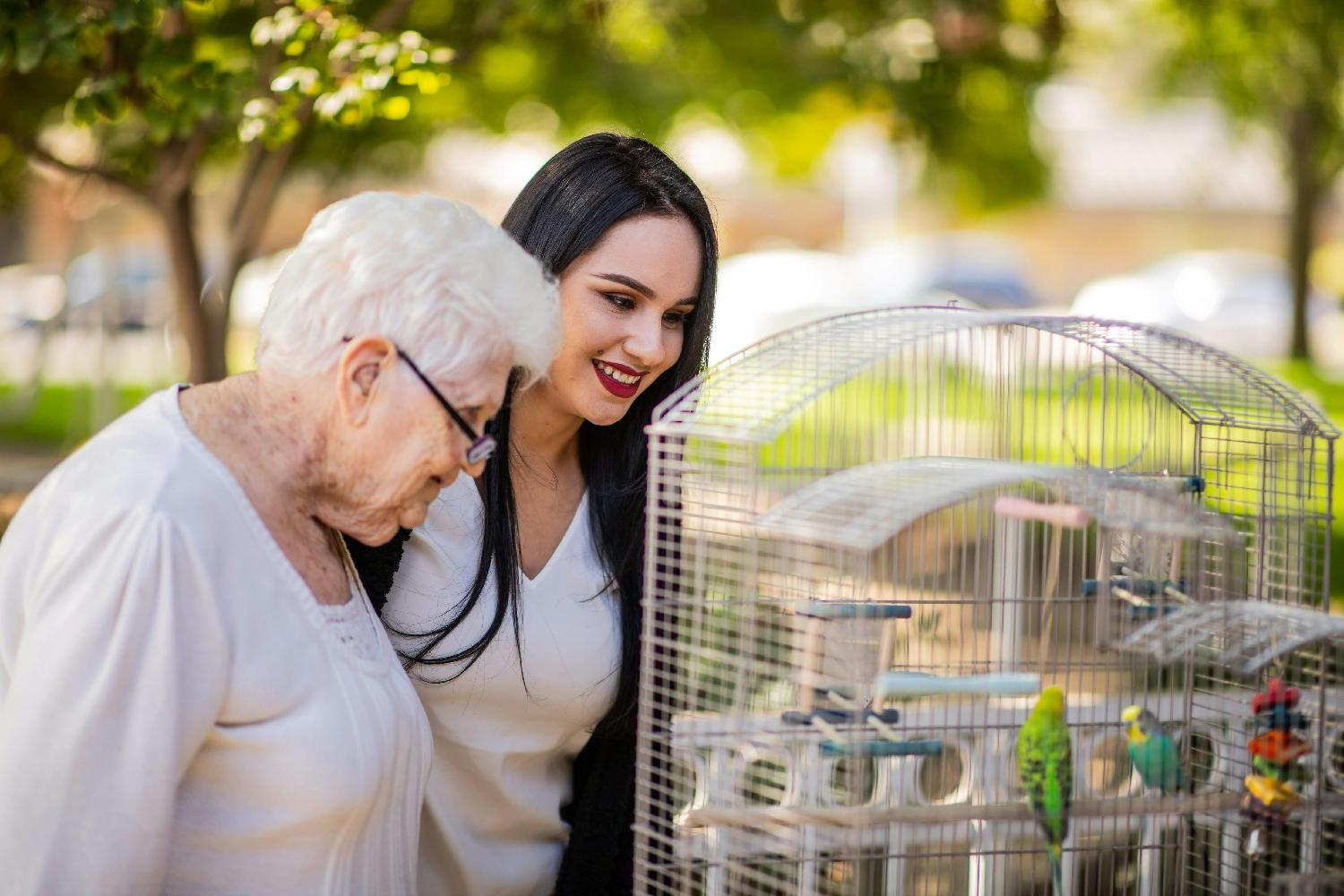 Eduro Healthcare employee watching birds in the facility gardens.