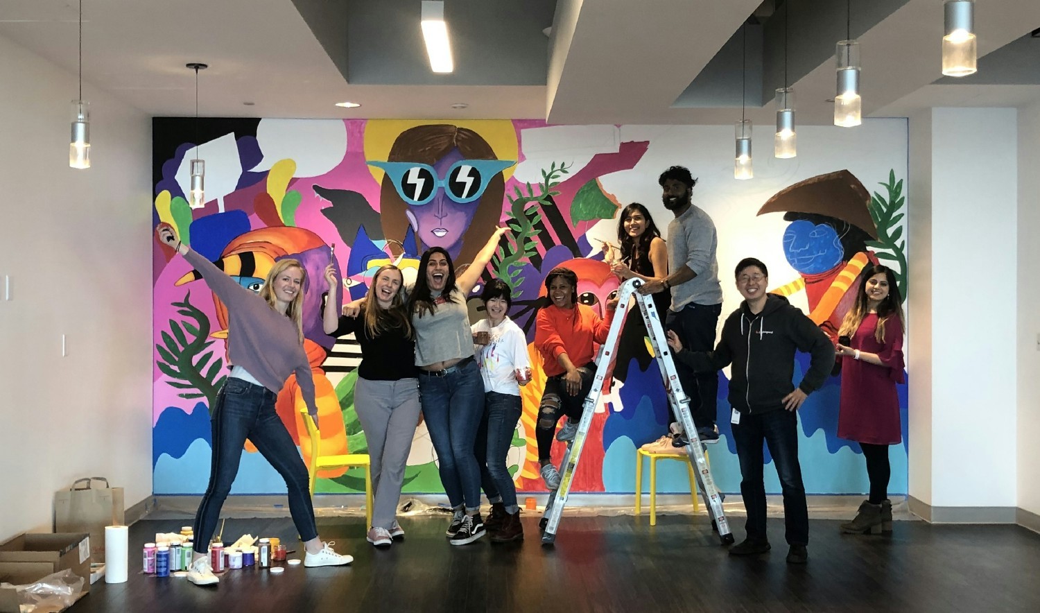 Our employees painted a mural at our HQ office to represent the diversity at AppZen! 