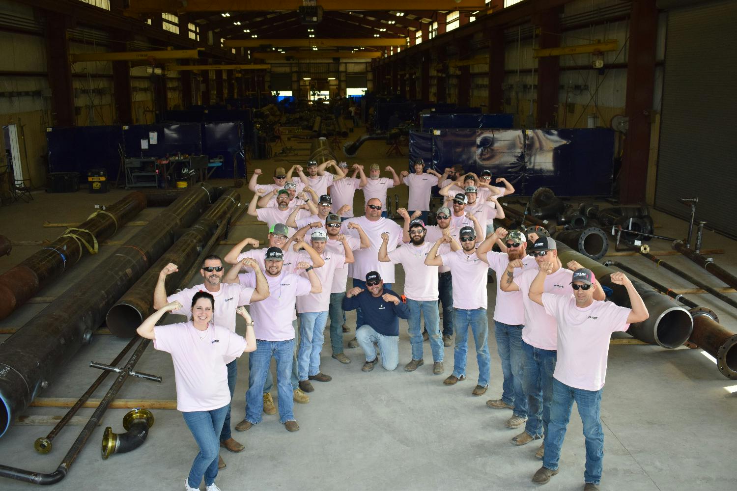 Nobody fights alone! Members of our fabrication shop proudly wearing pink to support the fight against breast cancer.