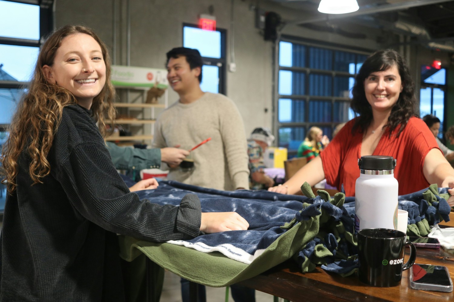 Making blankets for Corporate Social Responsibility at our holiday party in 2022