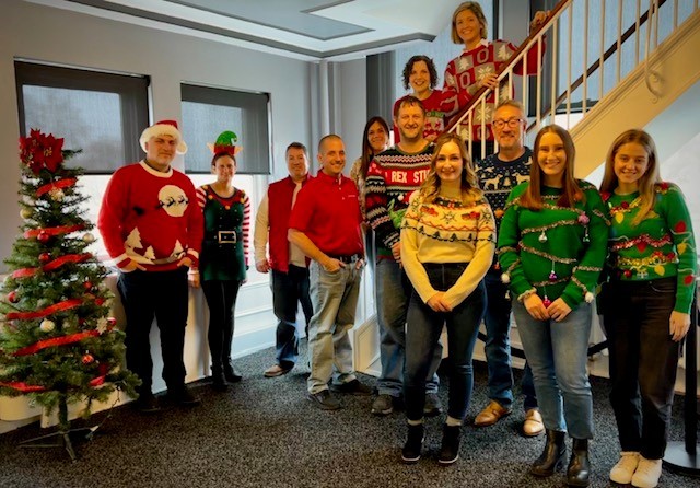 Festive-dressed Synergy team members