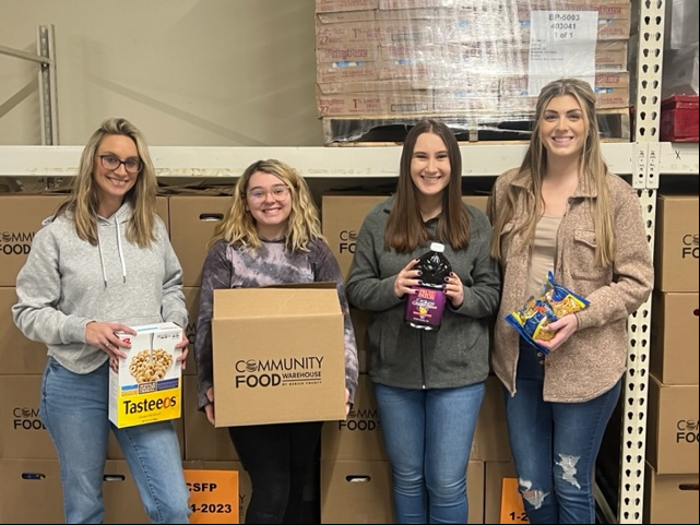 Synergy team members at our local nonprofit Community Food bank as part of our monthly volunteer program.