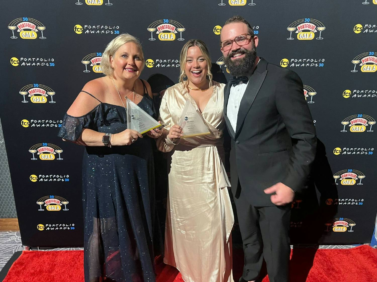 Our COO and members of our client team accepting an award for our client work -- May 2024