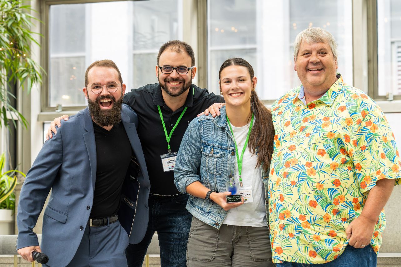 Our CEO, COO and President presenting a member of our team with the PROUDy Award, for Core Value embodiment