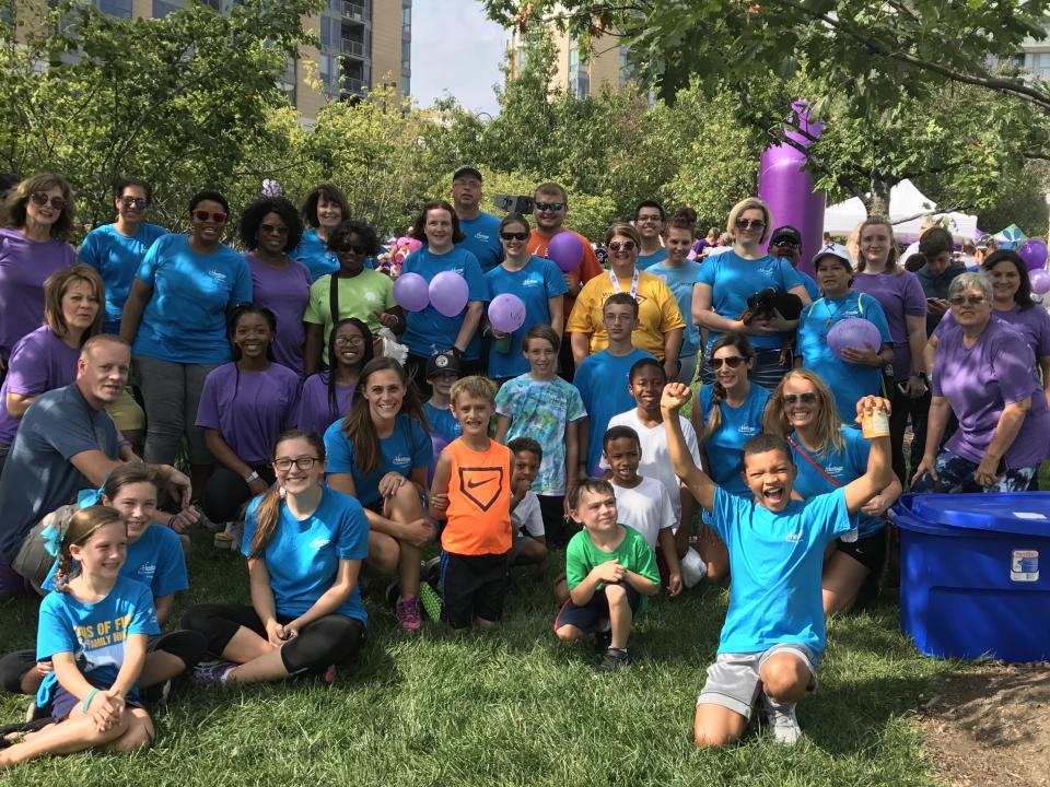 Associates walking together to raise money, to find a cure for Alzheimer's Disease