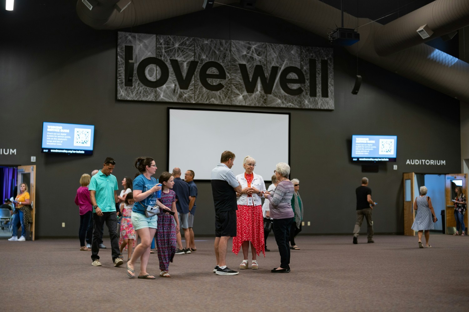 Weekend attendees in the Atrium of the Woodmen Heights Campus