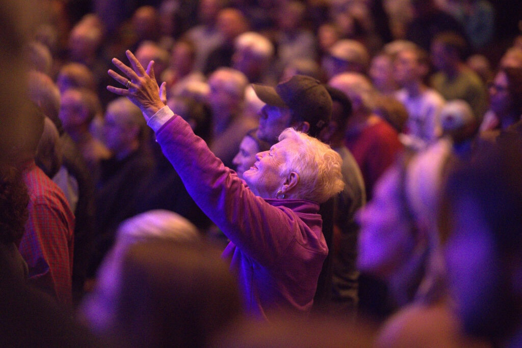 Attendee worshiping