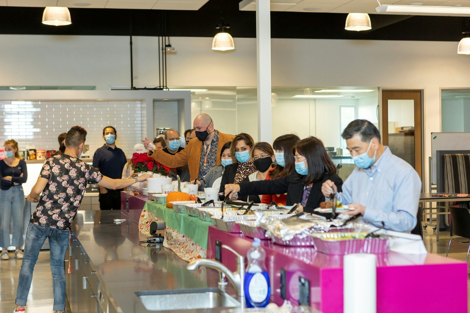 Celebrating and giving thanksgiving together during Neato's Thanksgiving potluck.