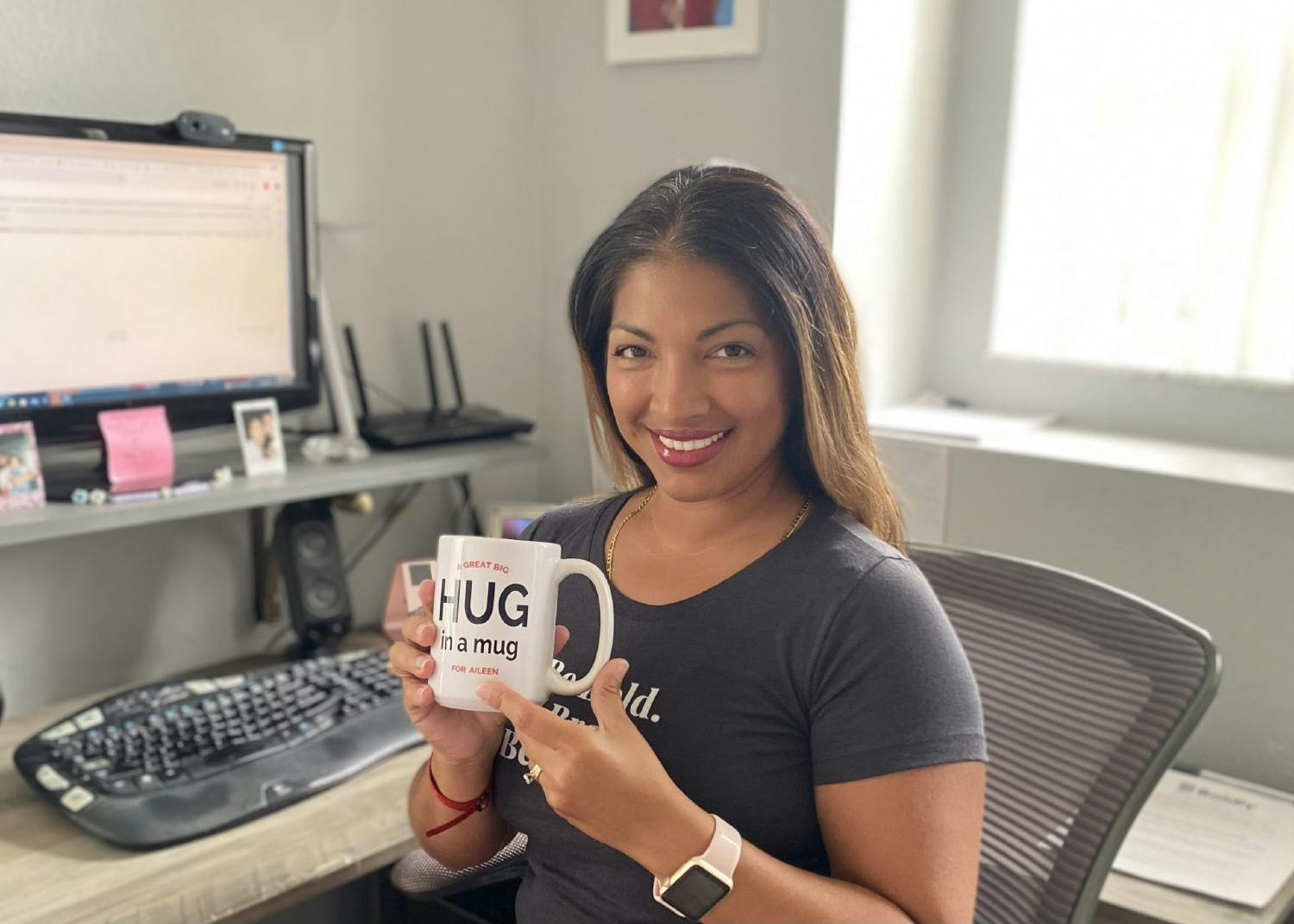 Aileen’s smile says it all, her Hug in a Mug prize reflects the warmth and care we share as a team!