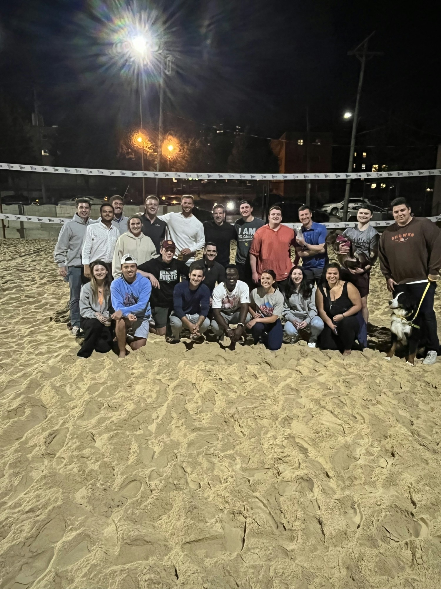 Team members in Cleveland taking part in an after-work intramural Volleyball league