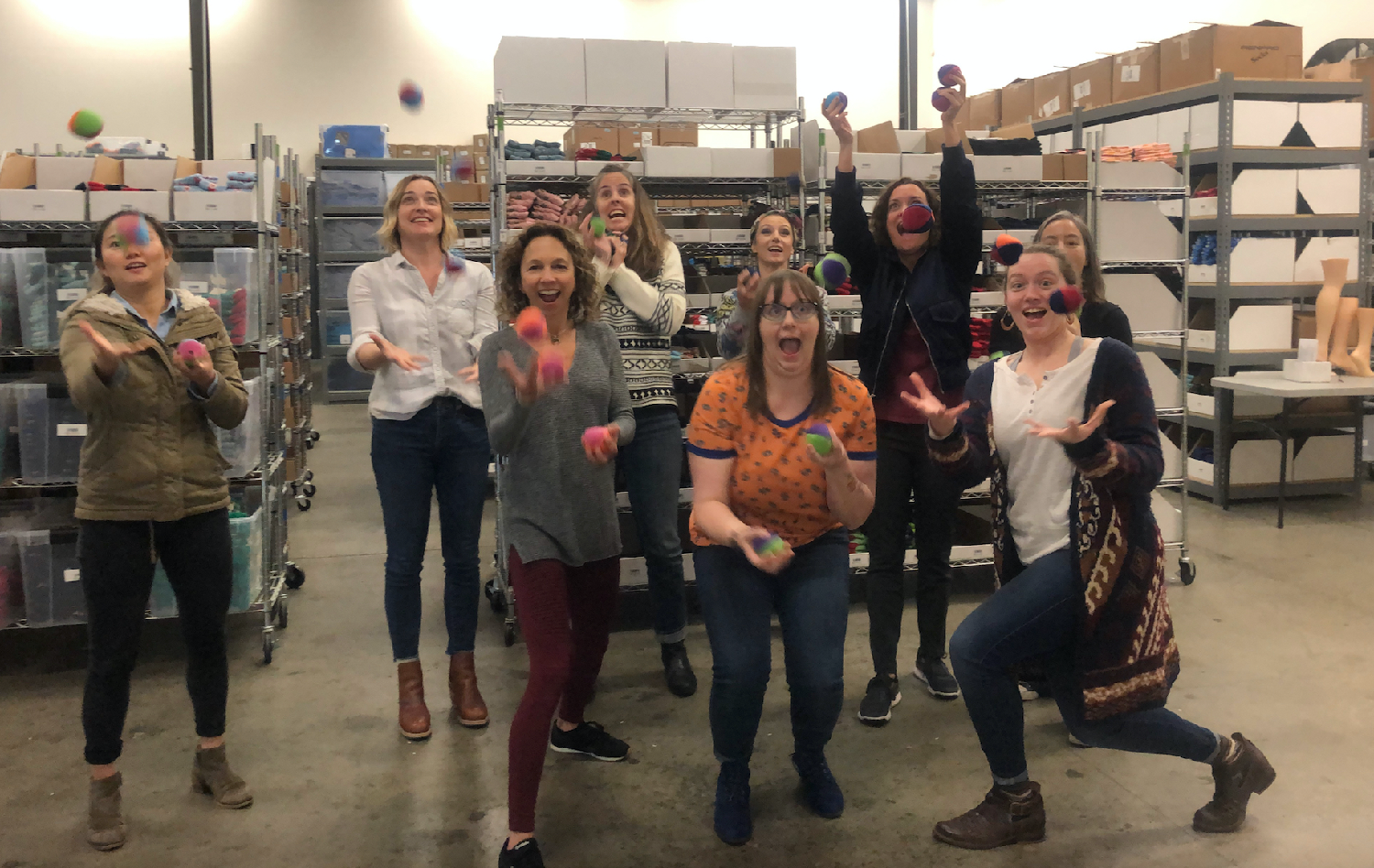 Juggling lessons?!  When you have a sock fairy juggler to lead, why not?  It’s Wellness Wednesday at the warehouse.