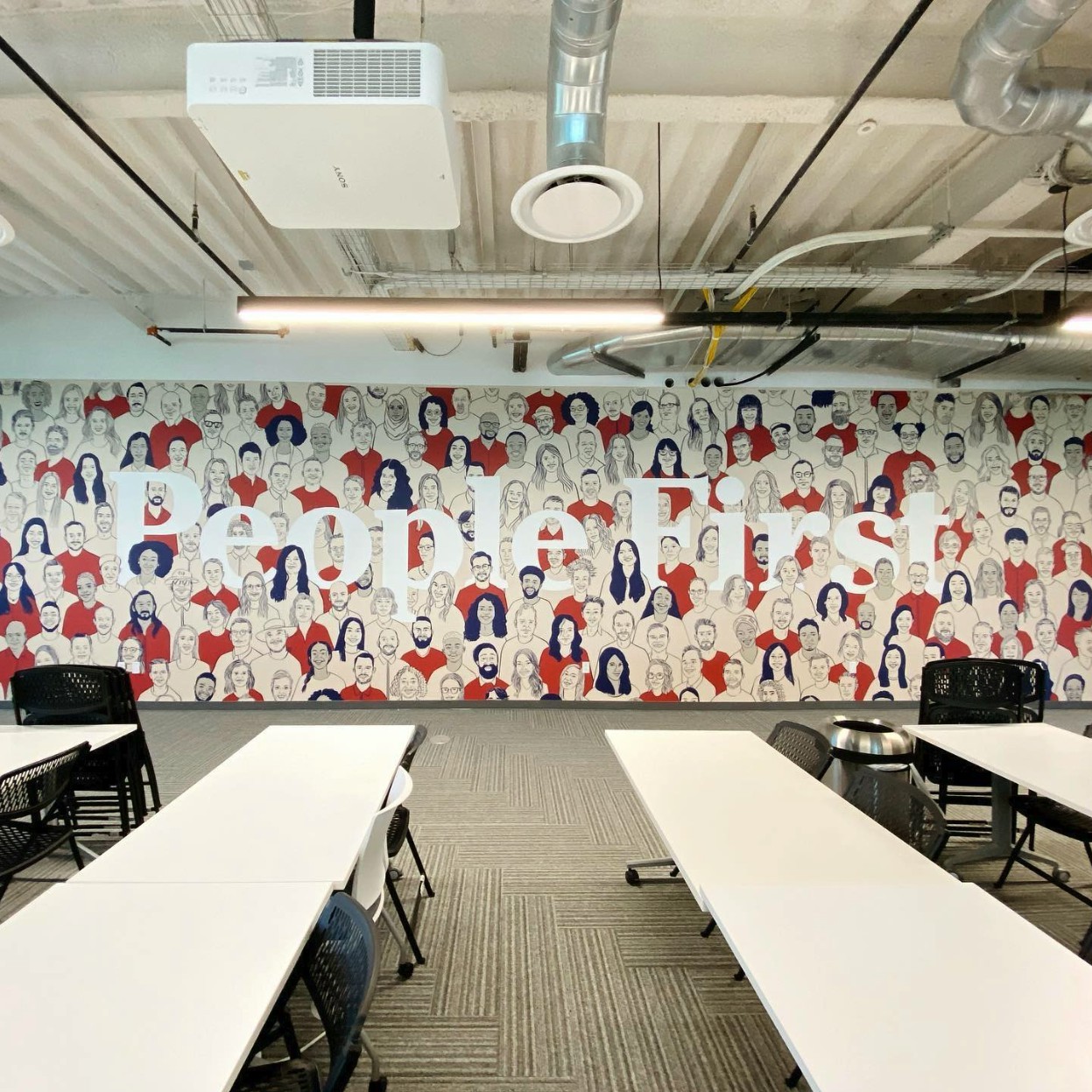 We are a people-first company, here is a mural of our people where we have all of our company meetings. 