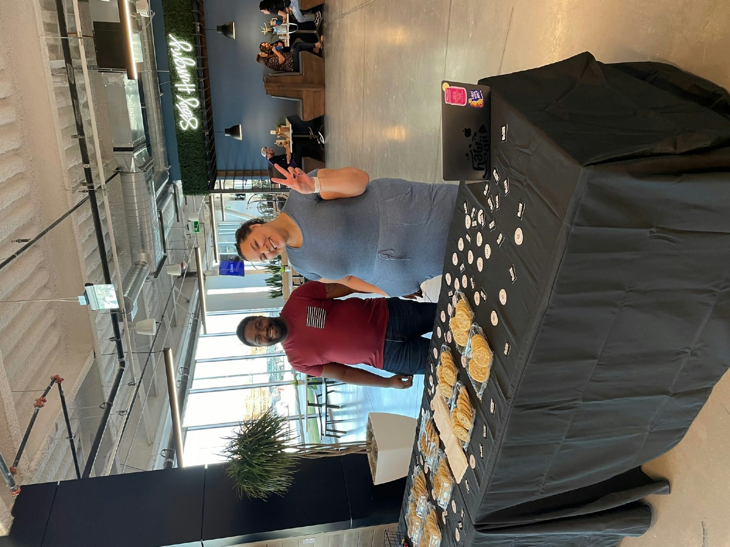 Employees at the Weave HQ with a treat table sponsored by the People Resource Group 