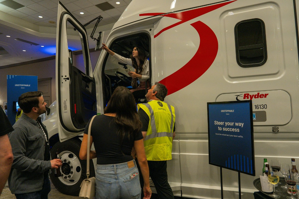 Employees seeing semi-truck outfitted with Samsara devices at our annual Sales Kickoff. 