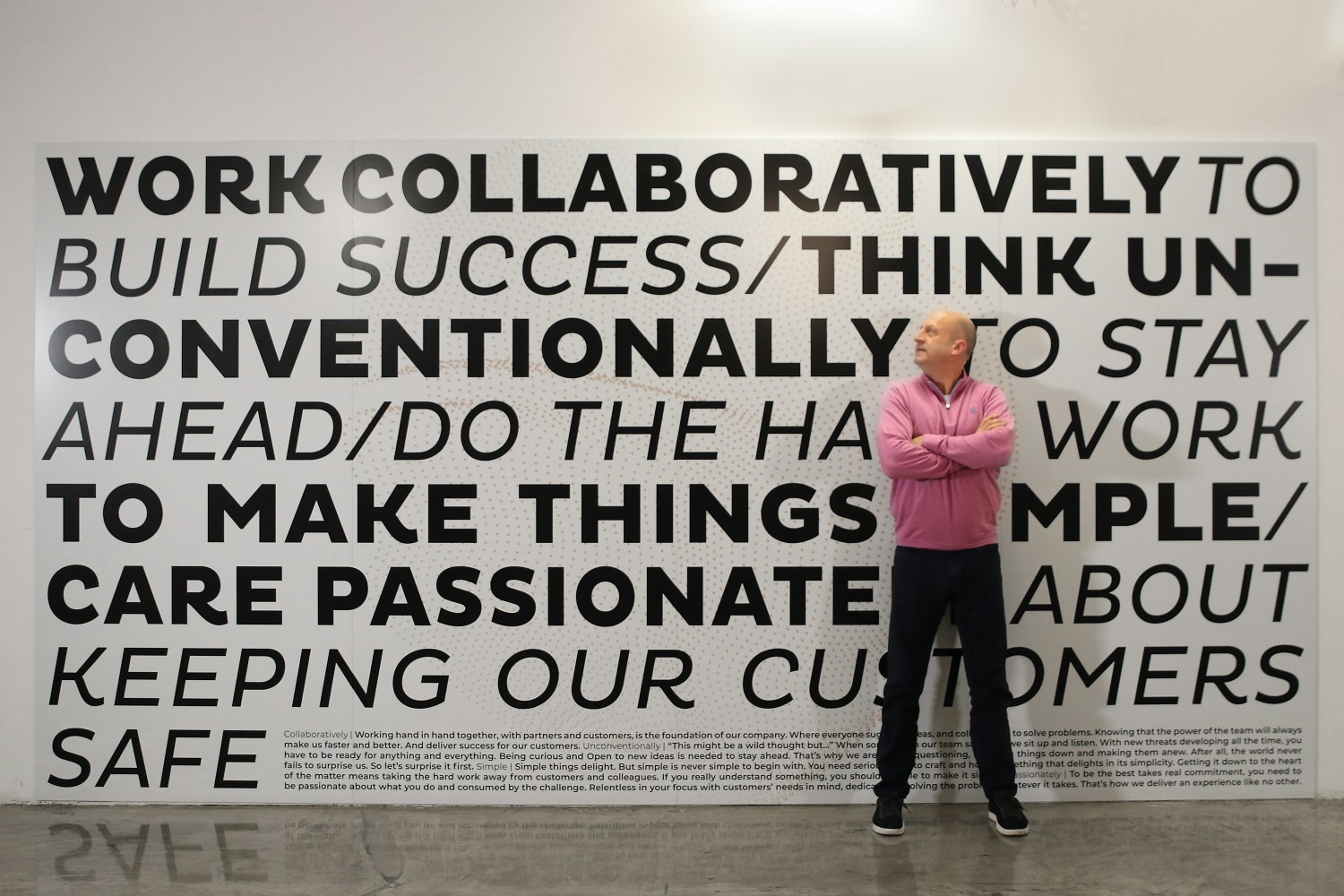 Our CEO, Geoff Haydon, in front of our Values wall