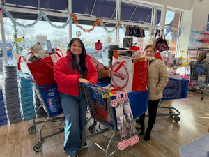 A day of giving back — filling carts with holiday cheer and essential items for local families.
