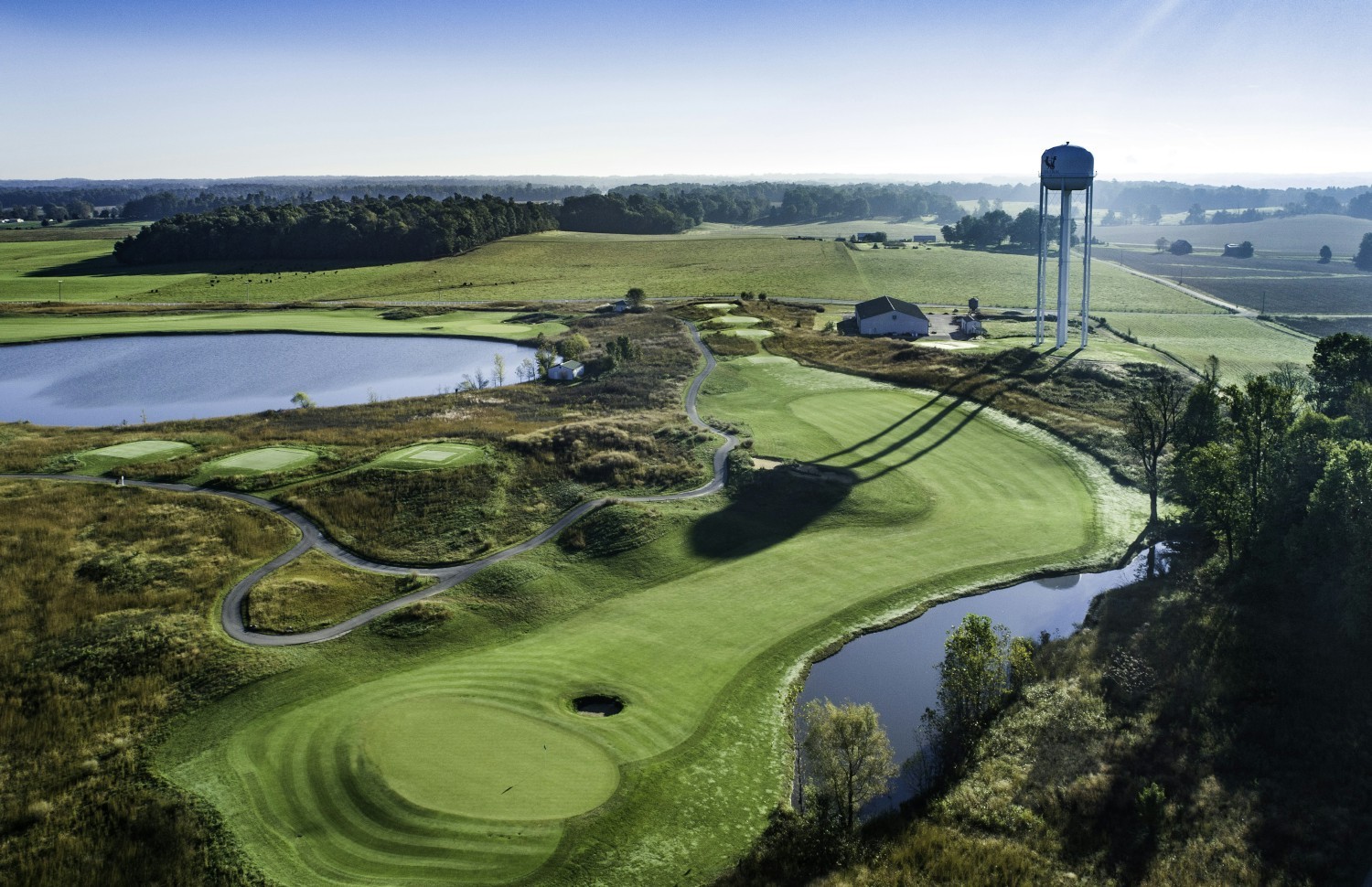 A view of Chariot Run Golf Course's astonishing bentgrass fairways and greens, sparkling lakes, and beautiful trees. 
