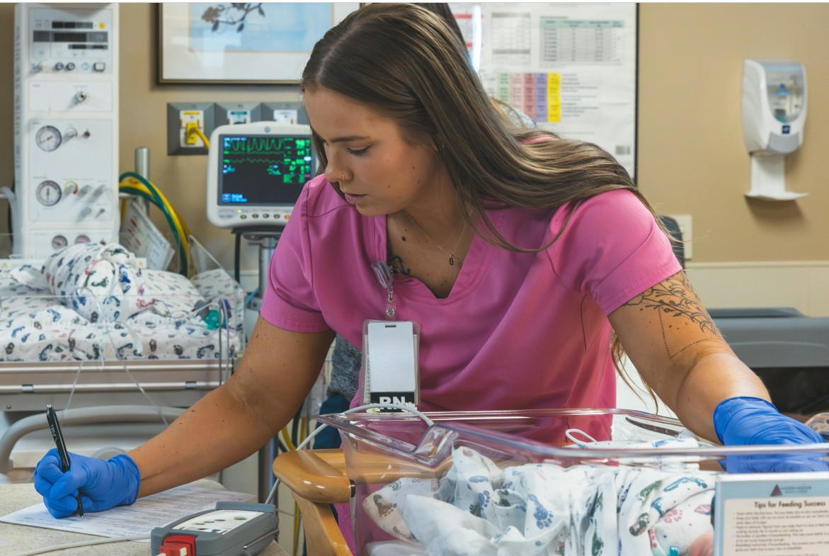 OB Nurse providing patient care