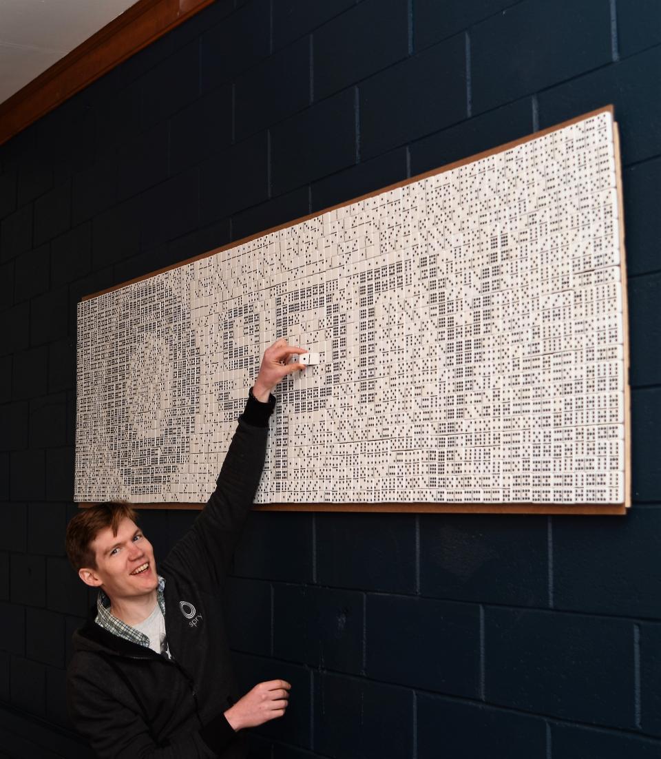 One of our engineers putting in the final domino to the staff project he led.