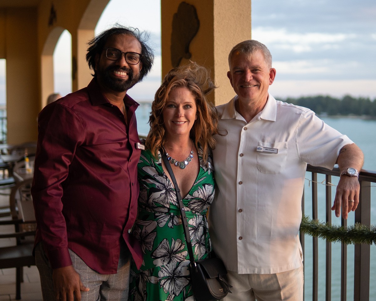 EMKS' Executive Vice President Erin Snyder and CEO Mike Snyder pausing for a picture with a guest during celebrations