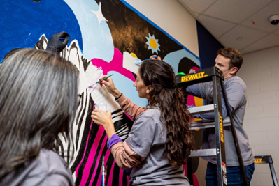 Insmed colleagues painting murals during our annual Global Day of Good