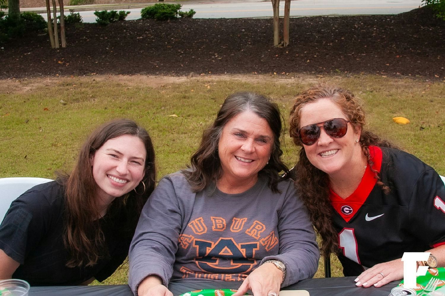 We take our football seriously. At the FTI tailgate, rivals show their colors, but come together for the grill out.