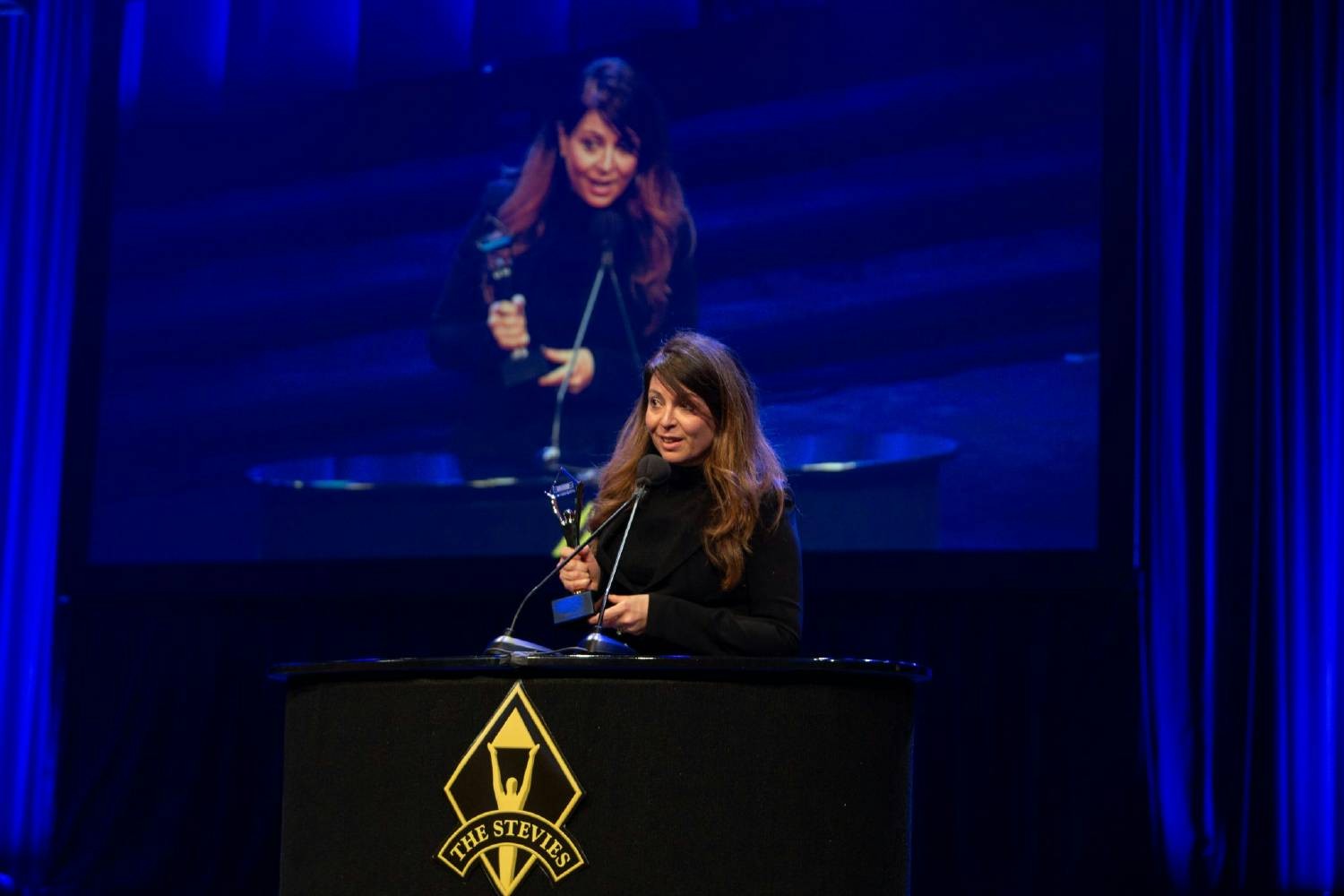 Allison Ceraso, CCO, receiving a Gold Stevie Award 