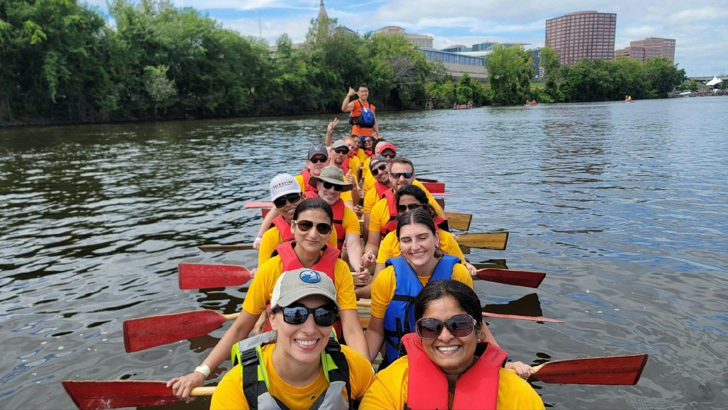 Employees from Selective's Glastonbury, CT office participating in a Dragon Boat competition in Hartford, CT.