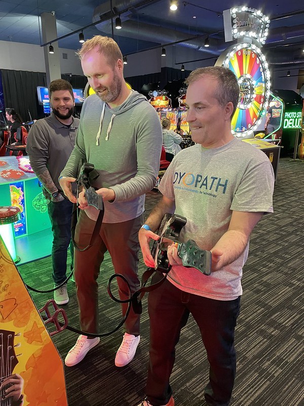 Our CEO playing guitar hero at Dave and Buster's
