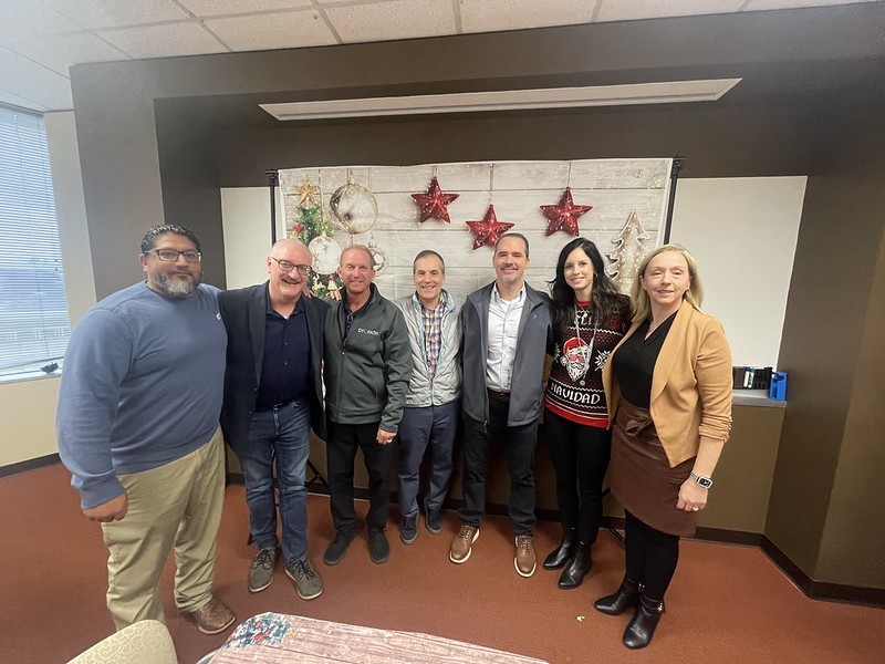 Executive team at the Houston office Ugly Sweater day luncheon.