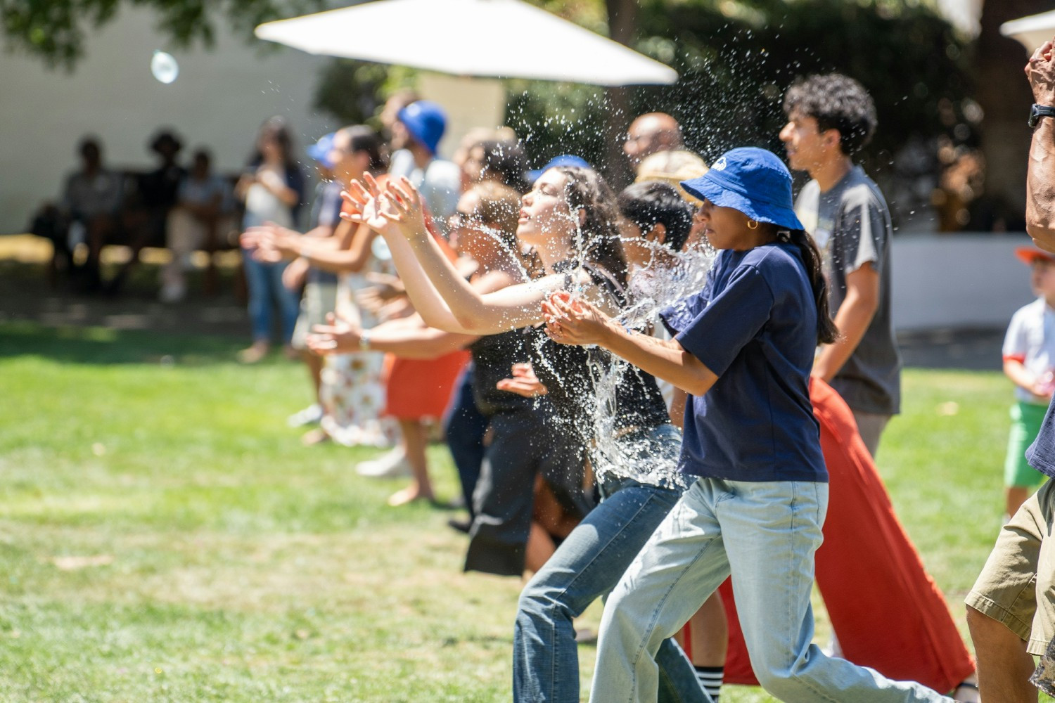 Balloon toss tradition.  Employees and their families came together at the annual summer picnic.