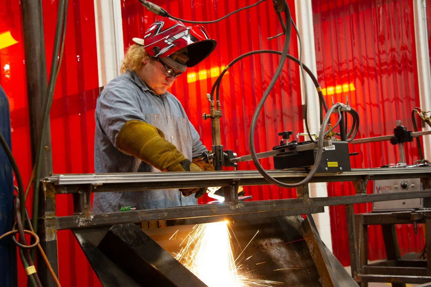 WELDING STUDENT PRACTICING FOR A BASIC WELDING SKILLS EXAM