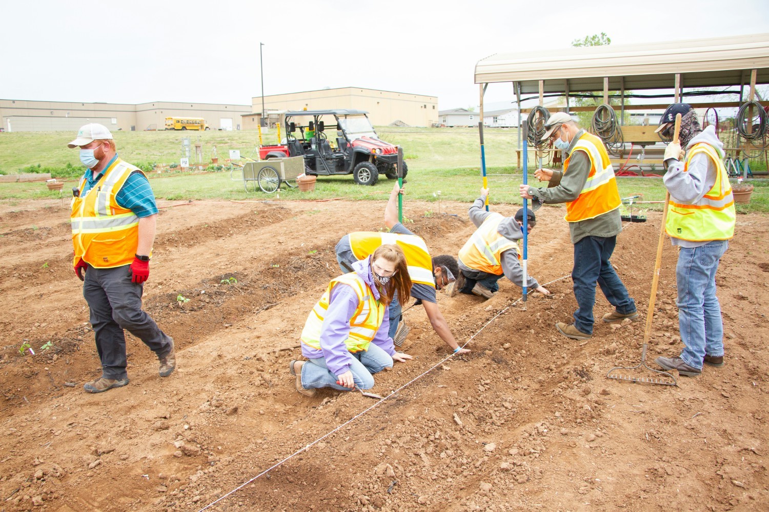 SERVICE CAREERS STUDENTS PLANTING PUMPKINS FOR A CLASS