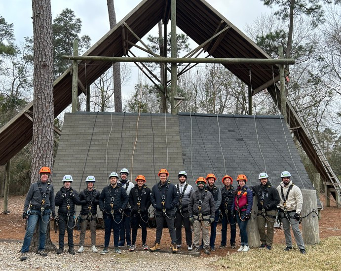 Consultants from J.S. Held’s Insurance Services Division finish ladder and rope-access training for steep roof situation