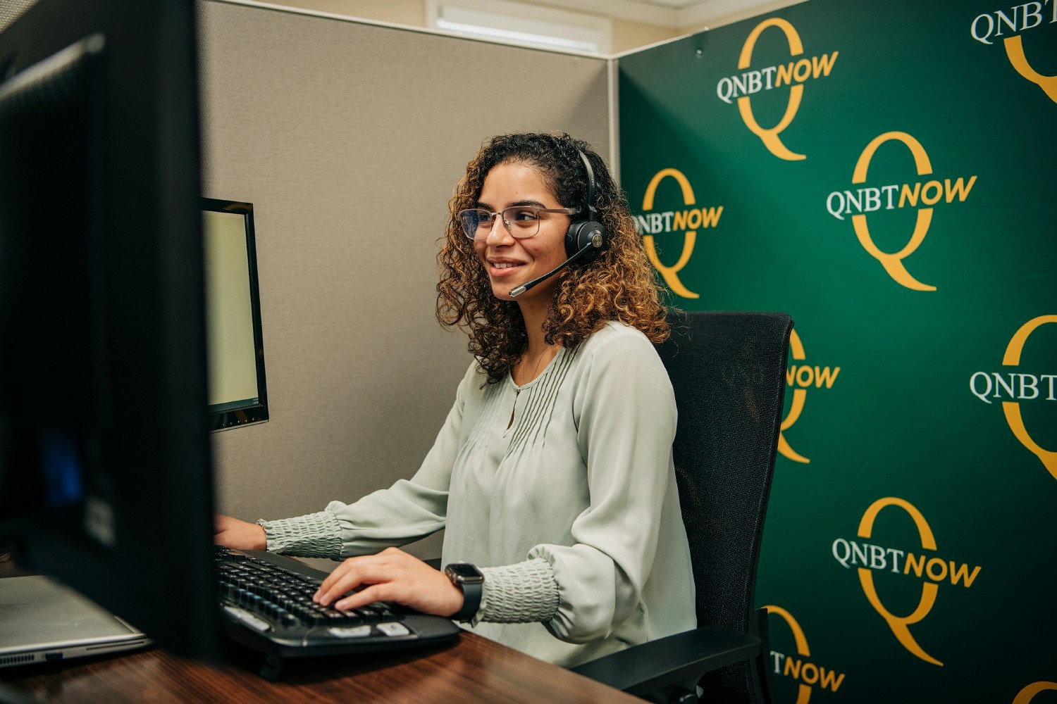 QNBTNOW team member working remotely to serve customers