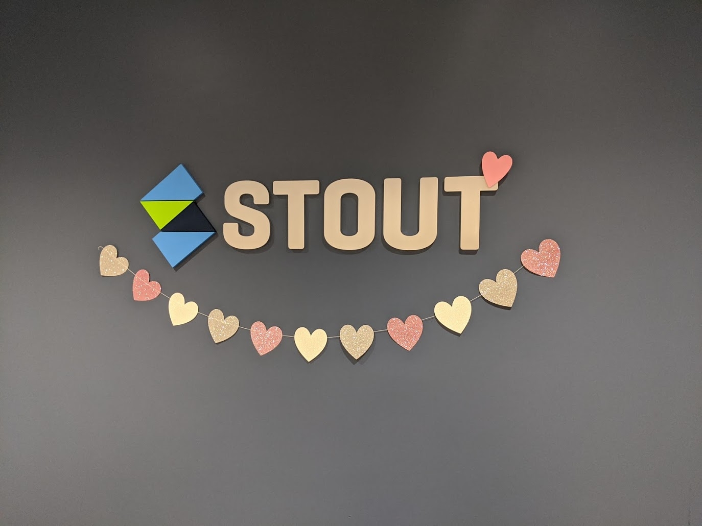Stout logo with hearts for Valentines celebration.