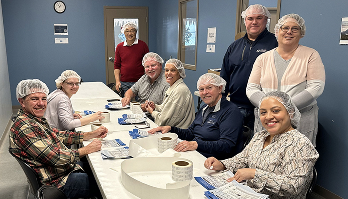 Always willing to be a helping hand Sasser employees volunteer time with Feed My Starving Children charities. 