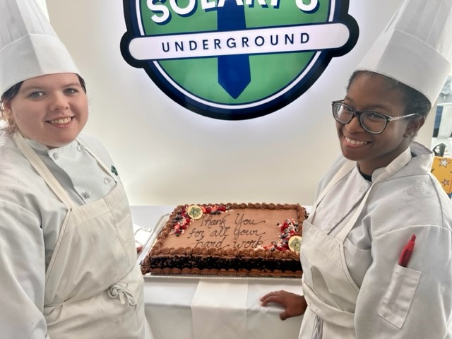Prepping a thank you cake for our employees