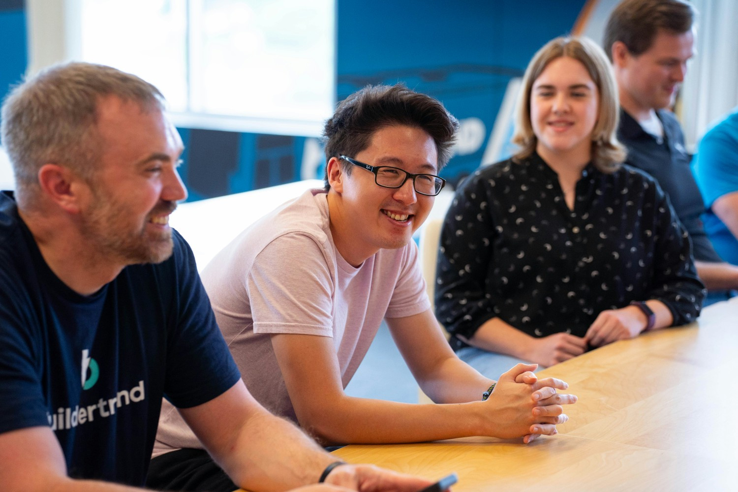 Product Engineering team collaborating to drive innovation and build solutions that shape the future of construction.
