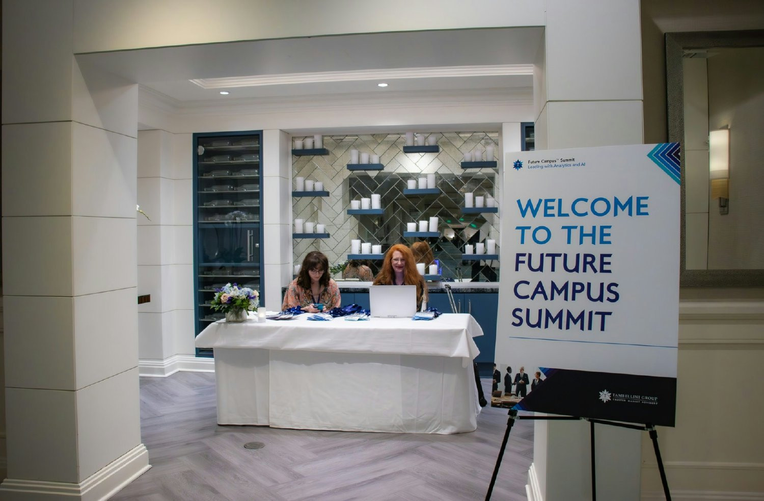 Team Members Jacqueline and Serena working the registration table at the Future Campus Summit. 