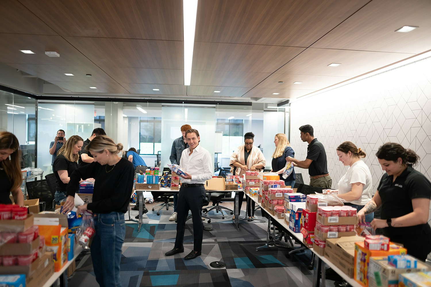iTechians come together to give back to the community, creating weekend food packs for local school children in need.