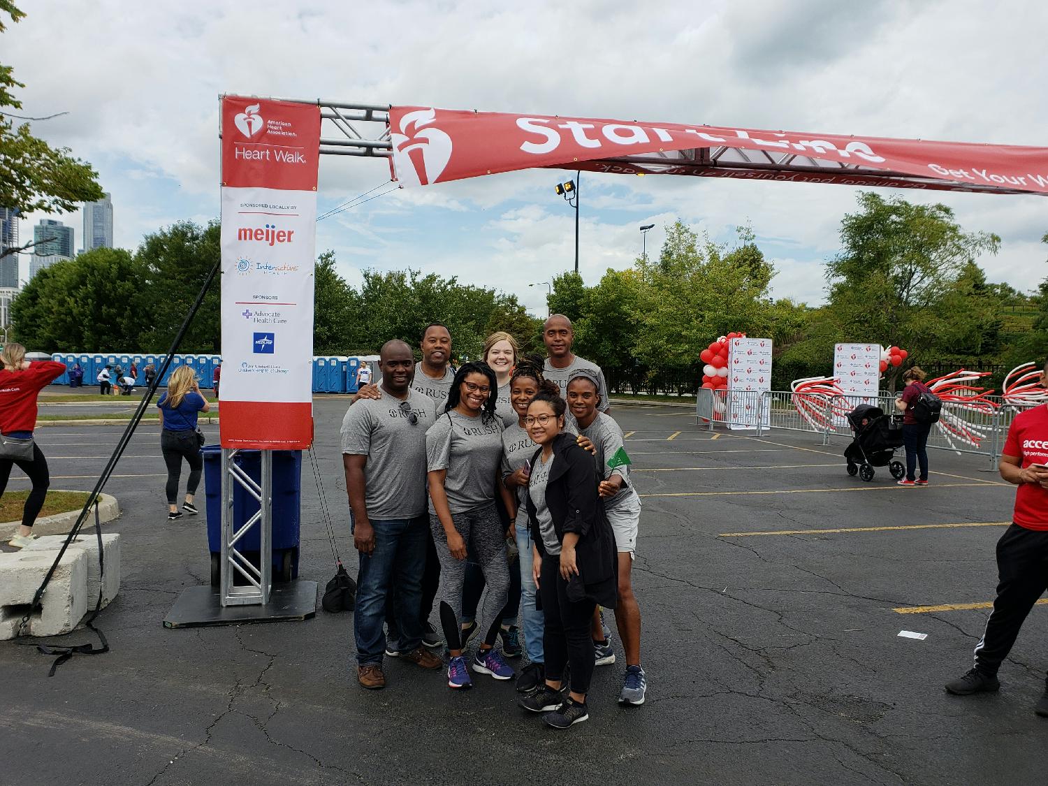 Team members participate in the American Heart Association's Heart Walk.